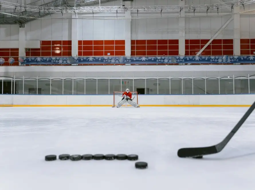 People Playing Ice Hockey on Ice Stadium